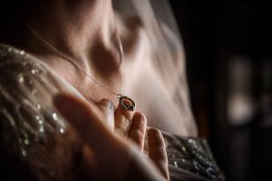 brides necklace hands